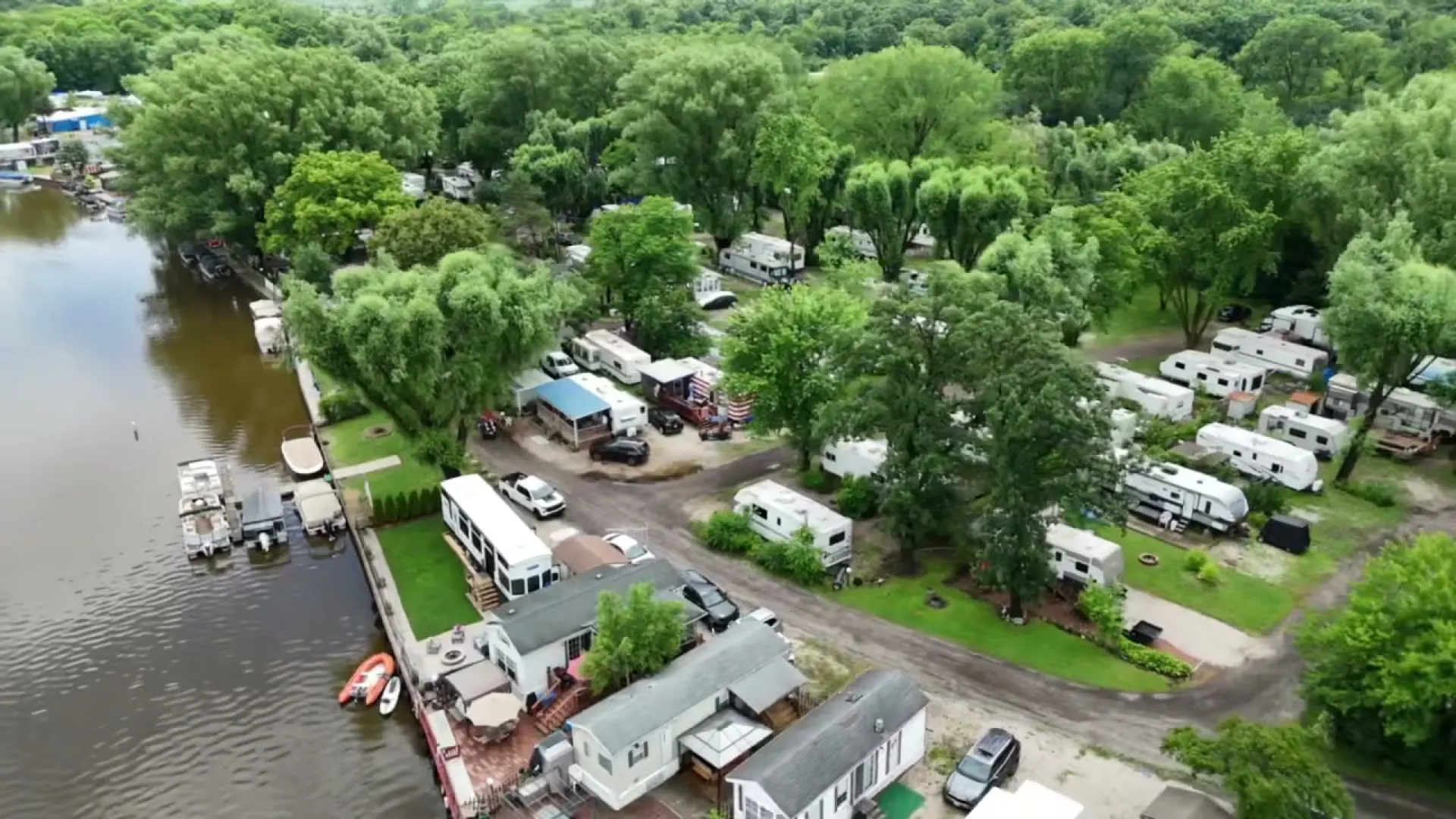 Aerial view of RV sites under the trees along the Fox River