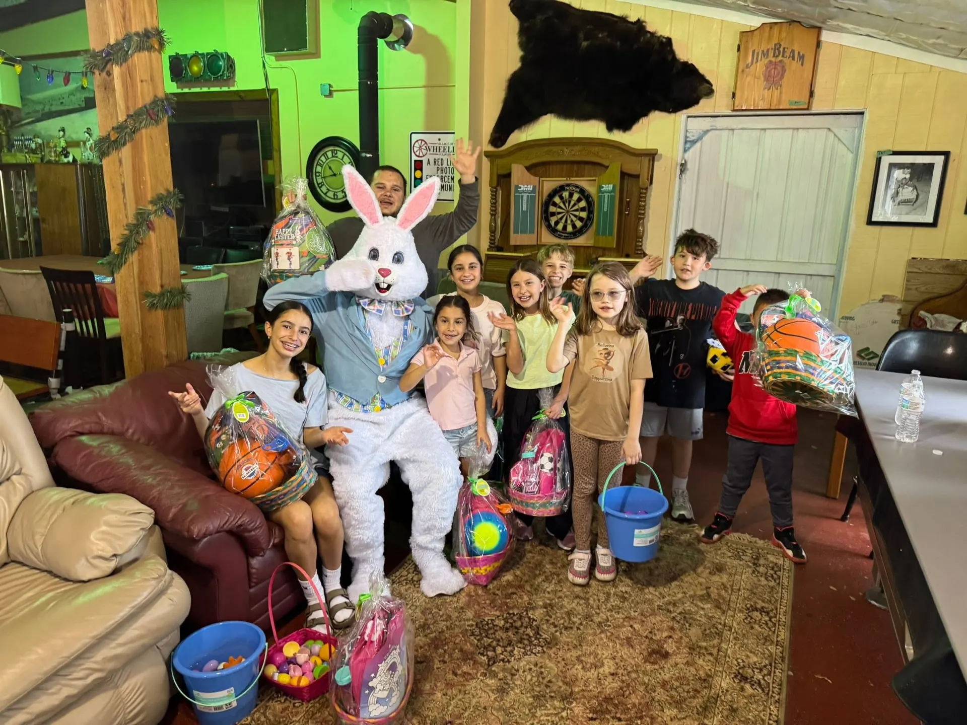 The Easter Bunny visiting kids in the lodge