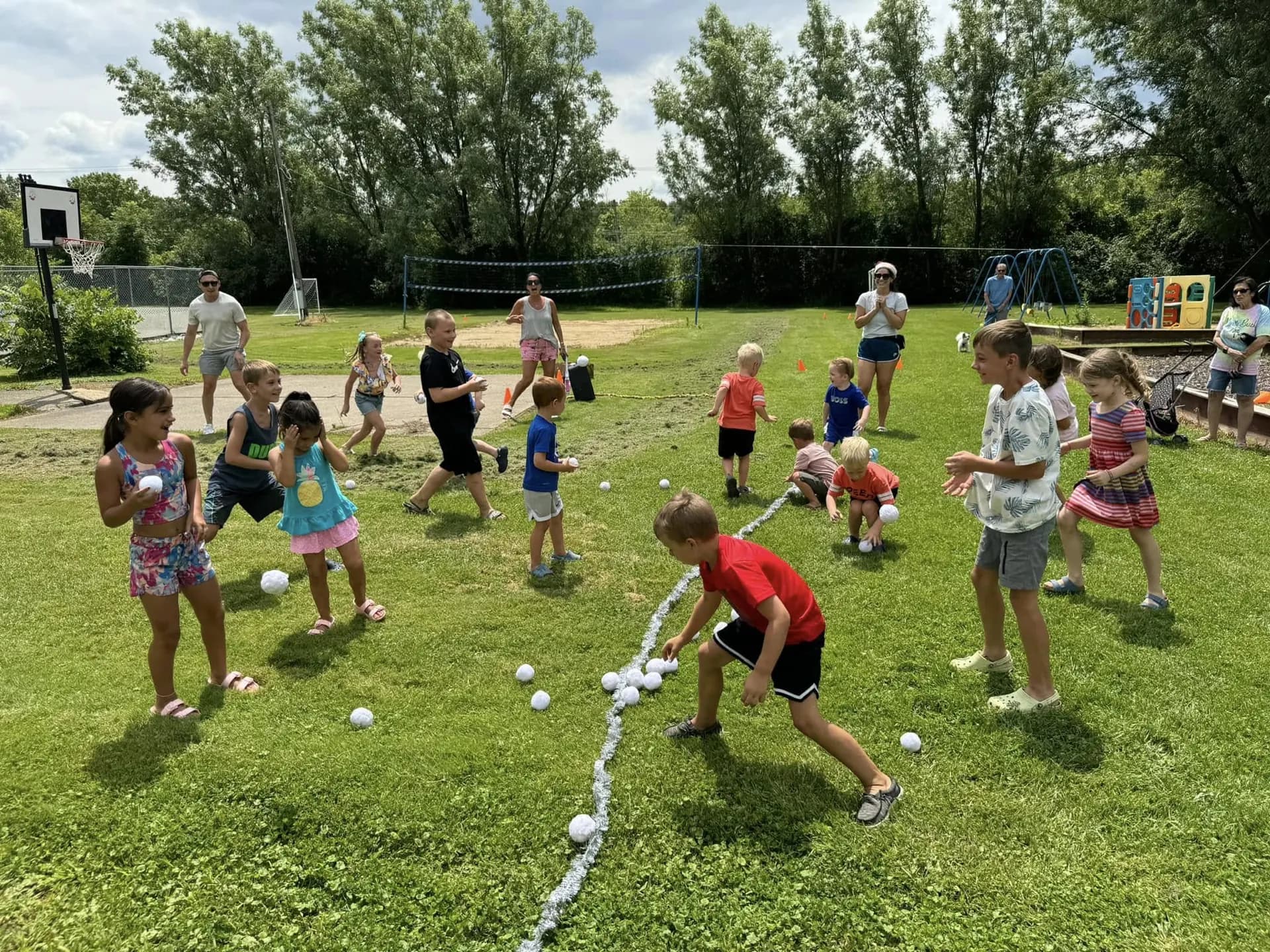 Kids racing through a lawn game on a summer afternoon