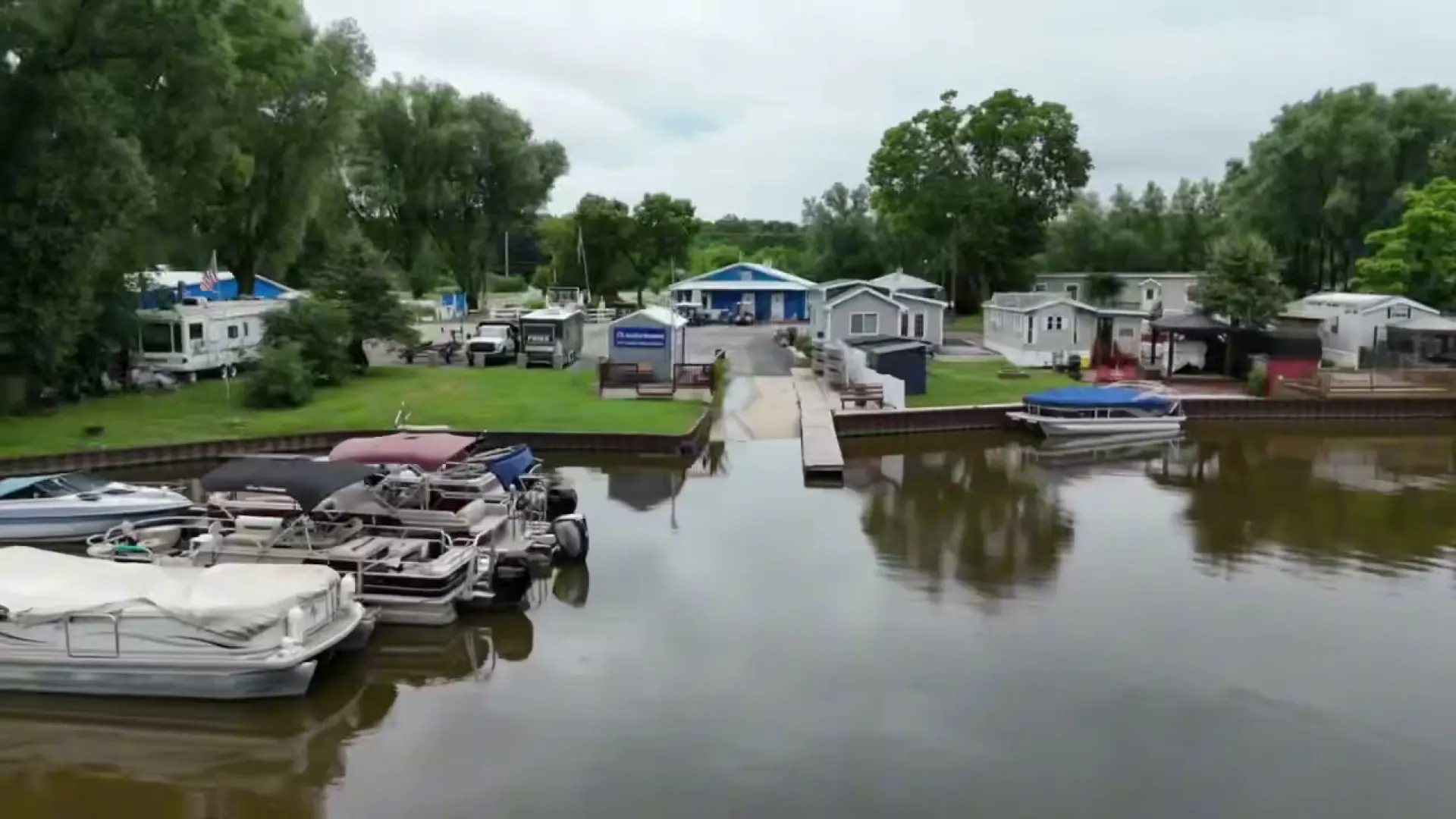 Pontoon boats tied up at the campground docks on the Fox River