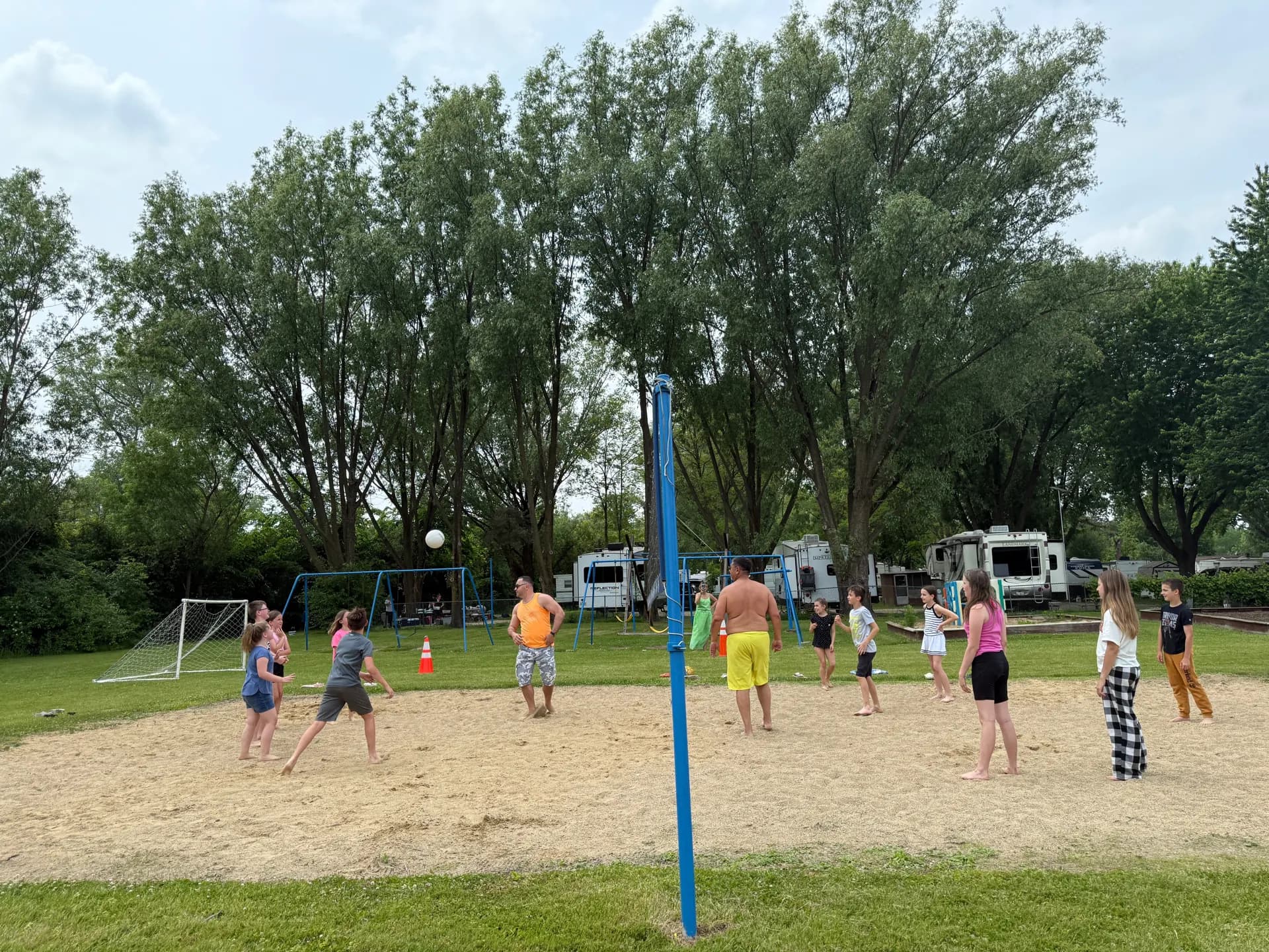 A game of sand volleyball beside the RV sites